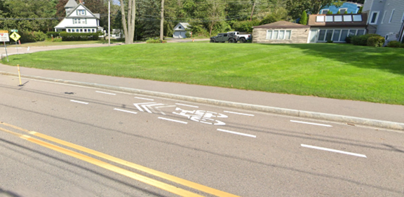 Shared bicycle lane markings on Massapoag Avenue.